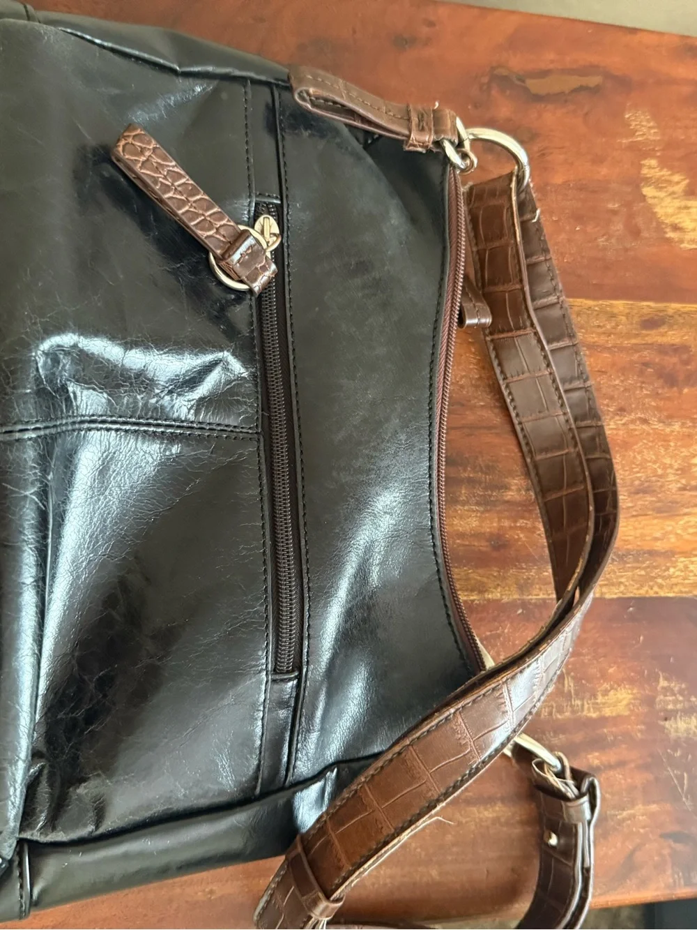 Women’s Brown and Black Shoulder Bag with Decorative Emblem